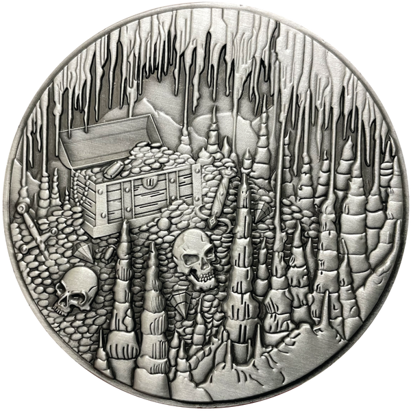 Load image into Gallery viewer, Silver metal coin with treasure chest and skulls in cavern
