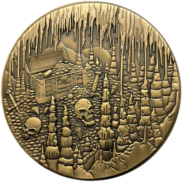 Load image into Gallery viewer, Gold metal coin showing treasure chest, skulls, and cavern
