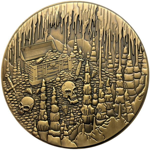 Load image into Gallery viewer, Gold metal coin showing treasure chest, skulls, and cavern