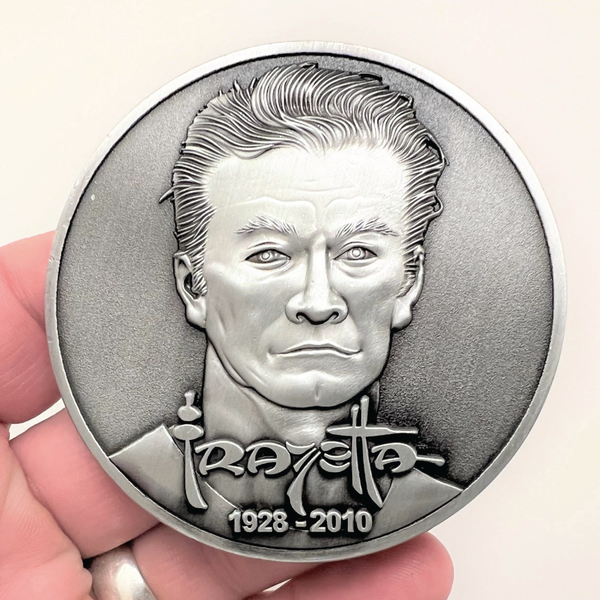 Load image into Gallery viewer, Silver metal coin showing Frazetta portrait with name and years 1928-2010