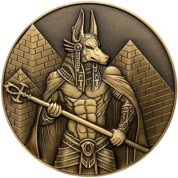 Load image into Gallery viewer, Gold metal coin showing Anubis next to pyramids