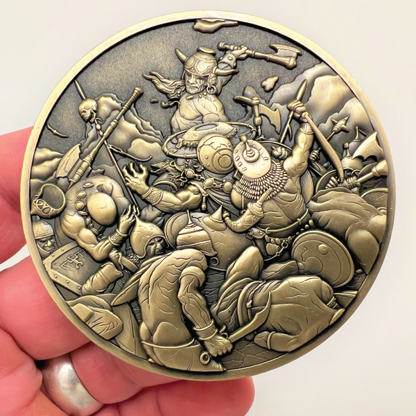 Load image into Gallery viewer, Gold metal coin in hand showing Destroyer
