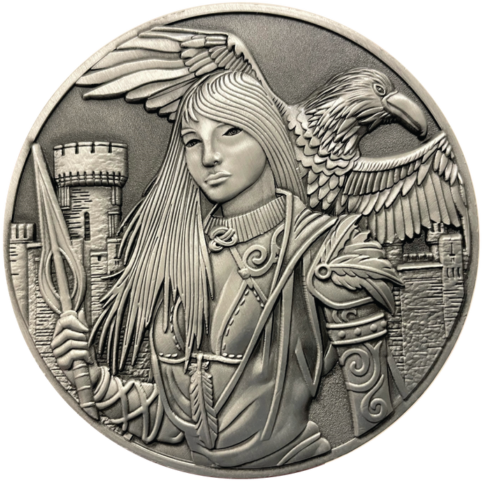 Silver metal coin showing Morrigan