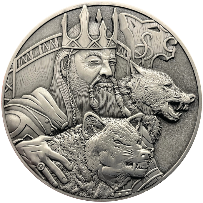 Silver metal coin showing Odin and wolves