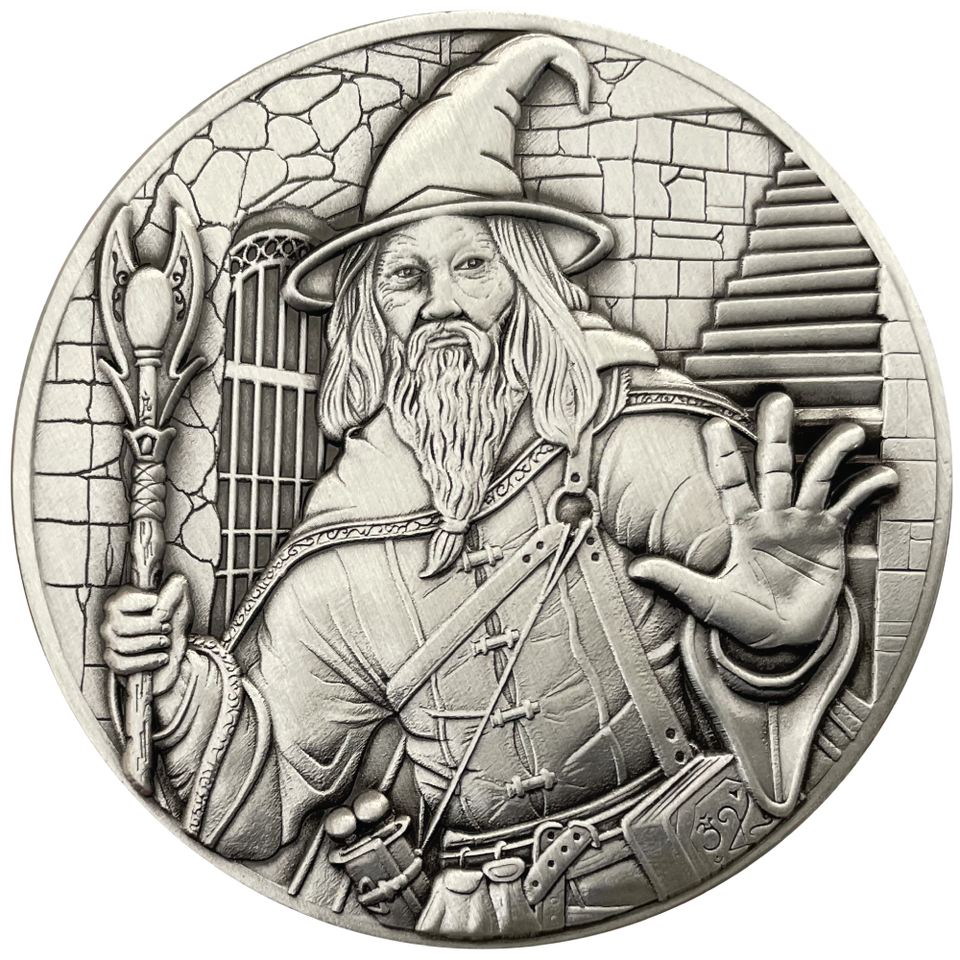 Silver metal coin showing a Wizard holding a staff