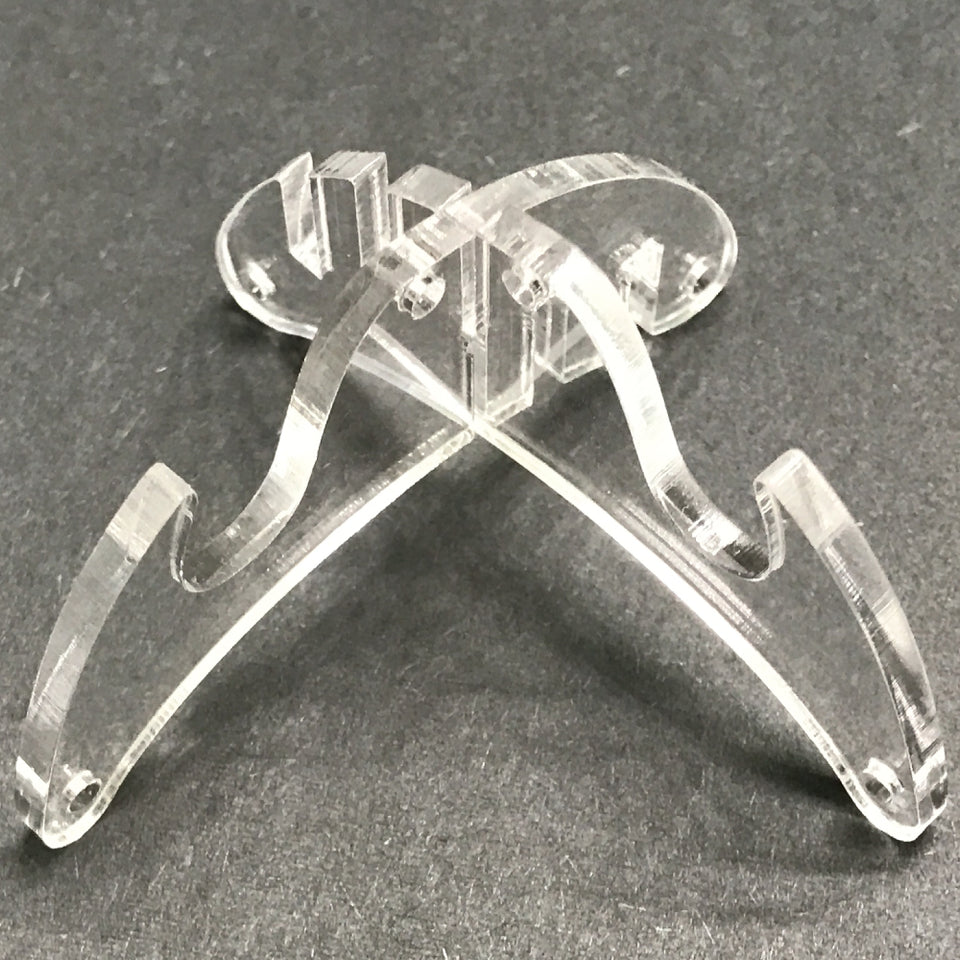 This is an empty plastic display stand that comes together and looks like an X.
