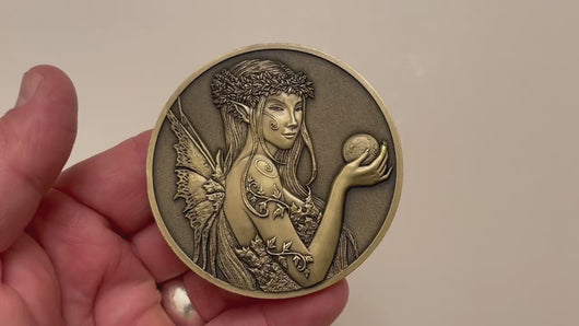 Video has no audio.  Video shows coin that is depicted on this product page, being held in hand and flipped over