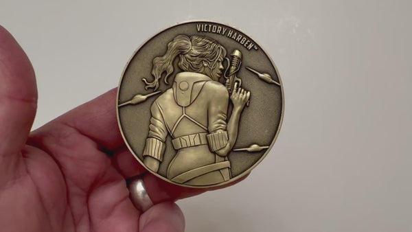 Load and play video in Gallery viewer, Video has no audio.  Video shows coin that is depicted on this product page, being held in hand and flipped over
