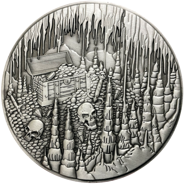 Load image into Gallery viewer, Silver metal coin showing treasure chest, skulls, and cavern
