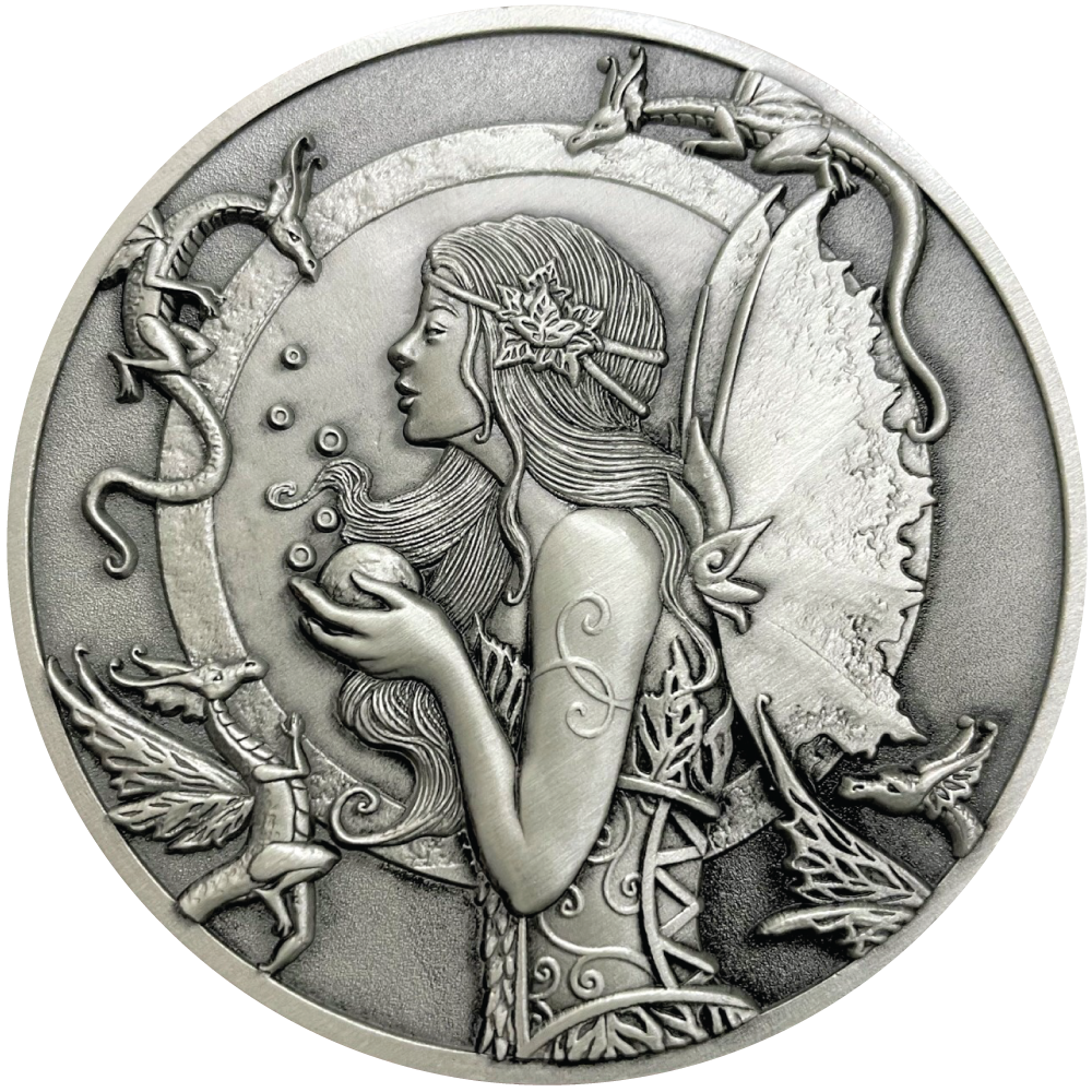 Silver metal coin showing fairy with small dragons around her
