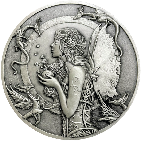 Load image into Gallery viewer, Silver metal coin showing fairy with small dragons around her
