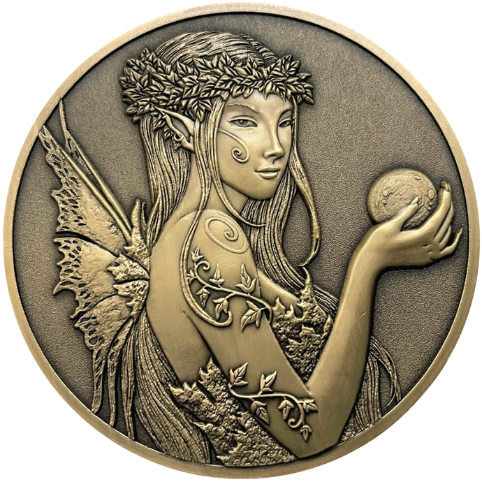 Gold metal coins showing fairy with ball in hand