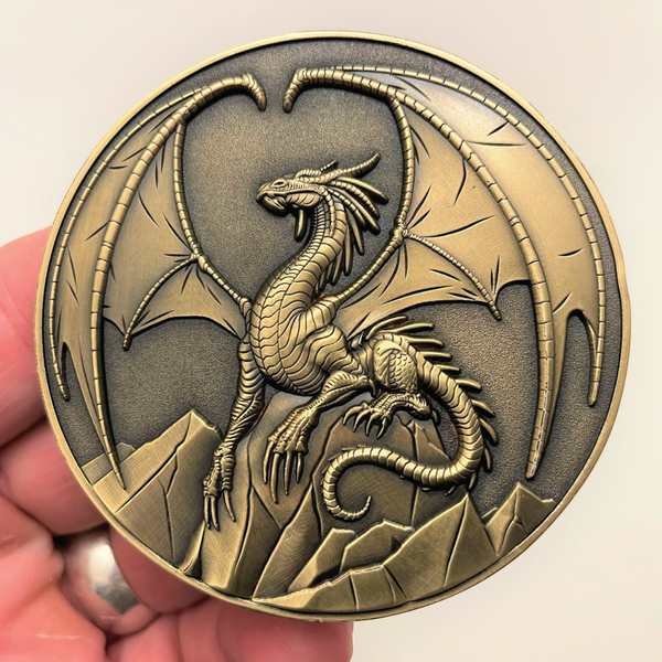 Load image into Gallery viewer, Gold metal coin in hand showing Lawful Gold Dragon
