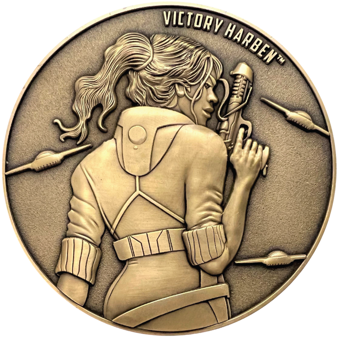 Gold metal coin showing Victory Harben